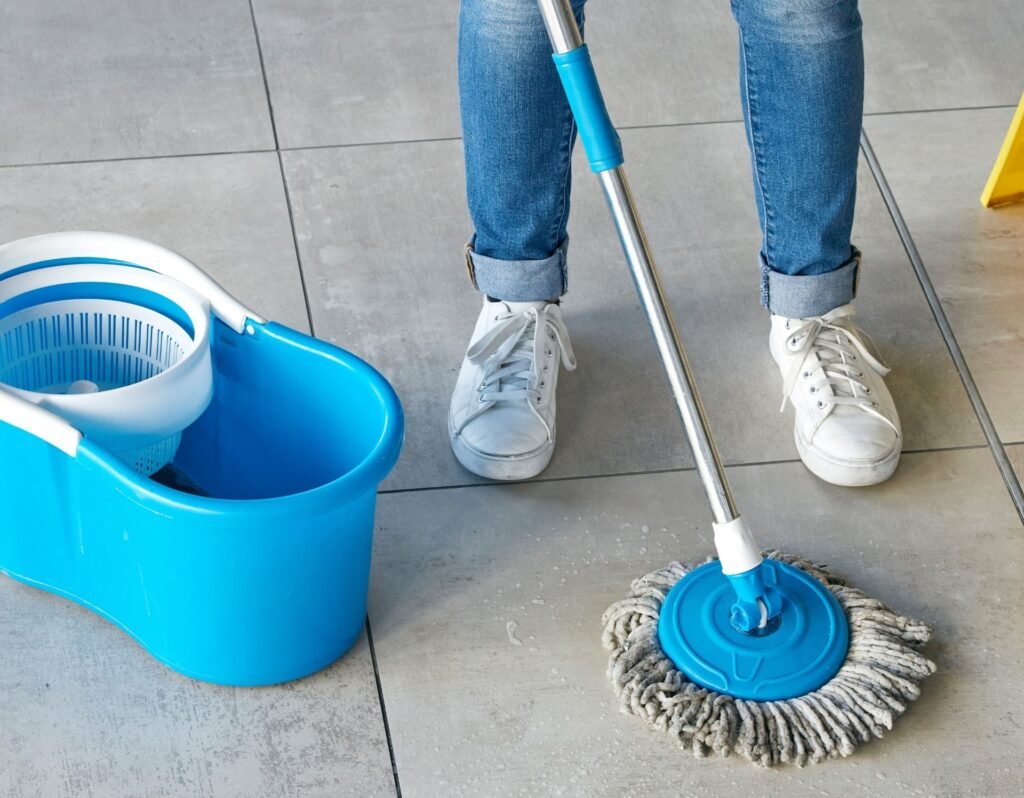 cleaning tools spin mop blue mop and bucket