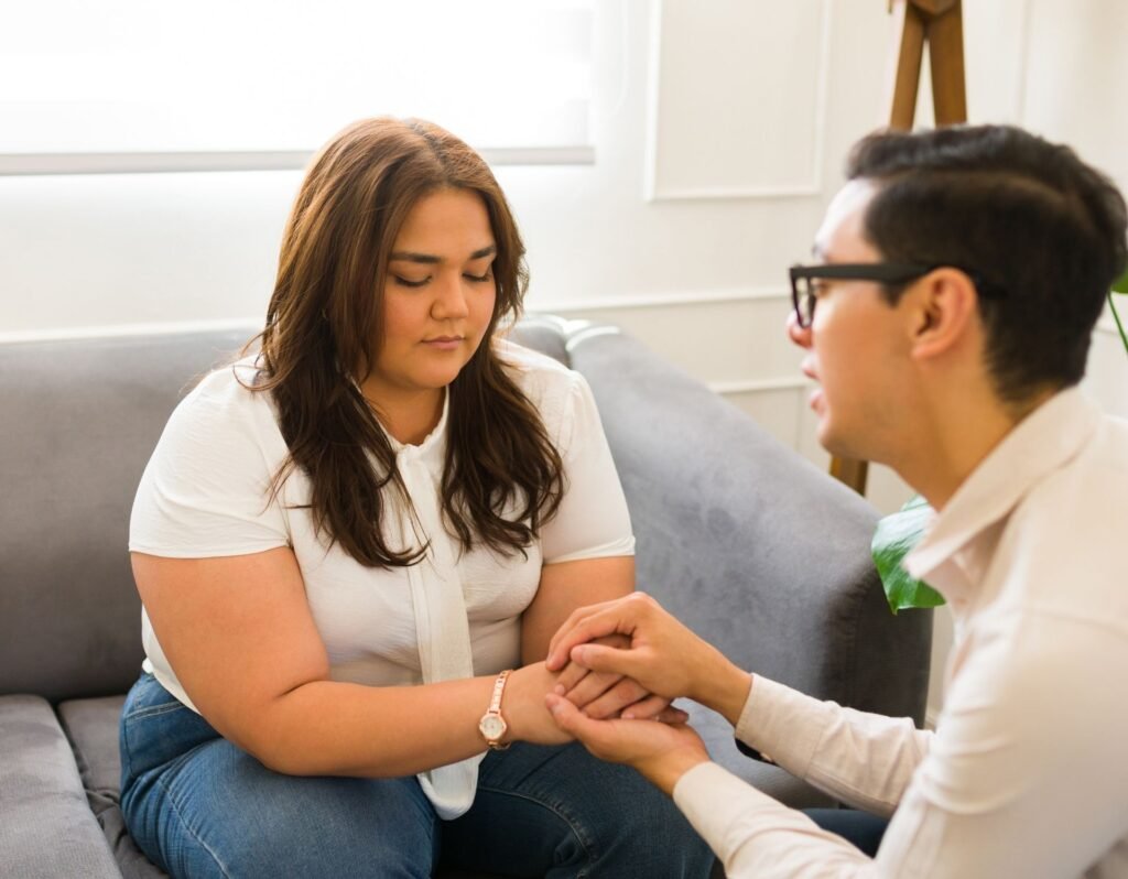 woman talking to man, asking for help