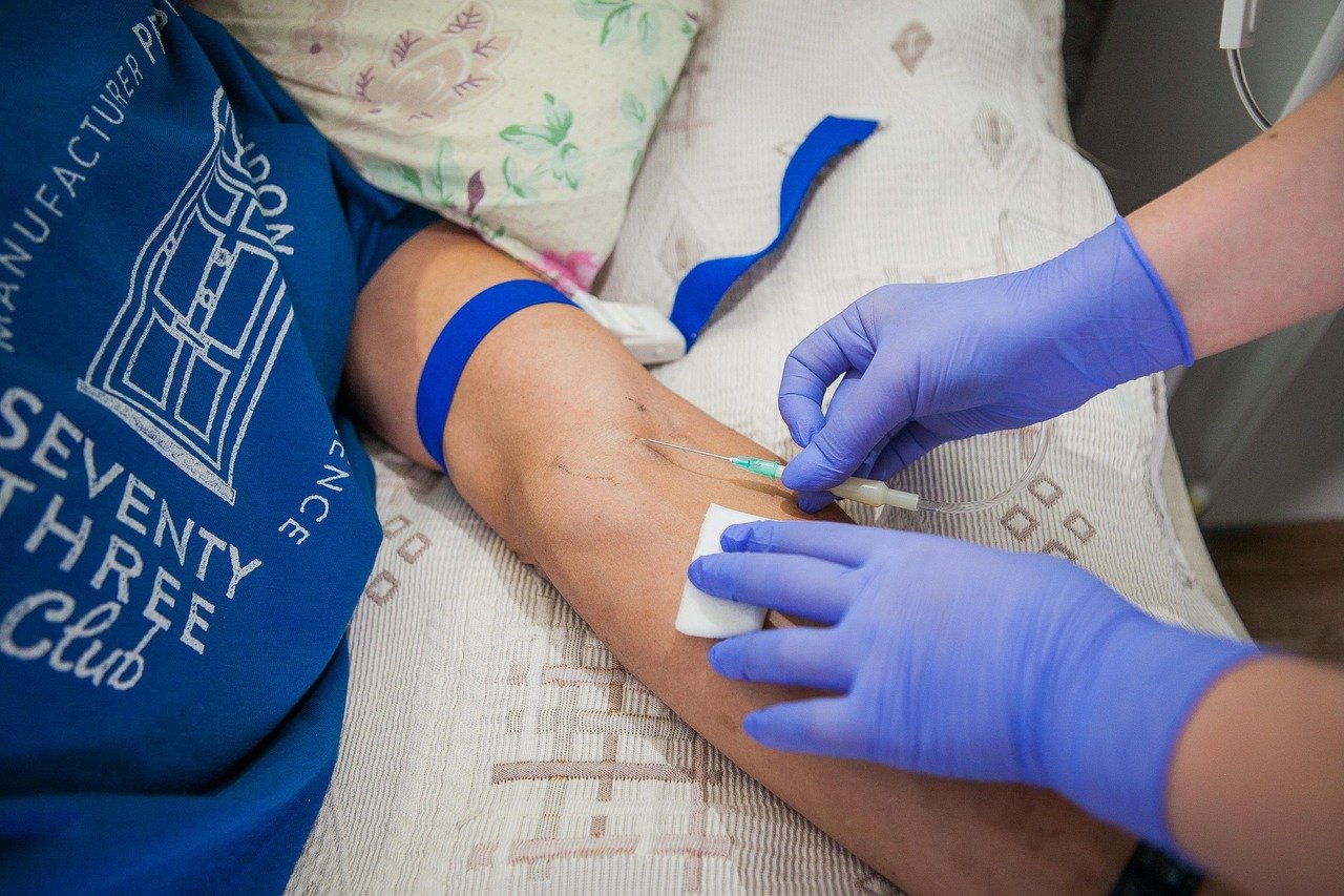 nurse starting an IV