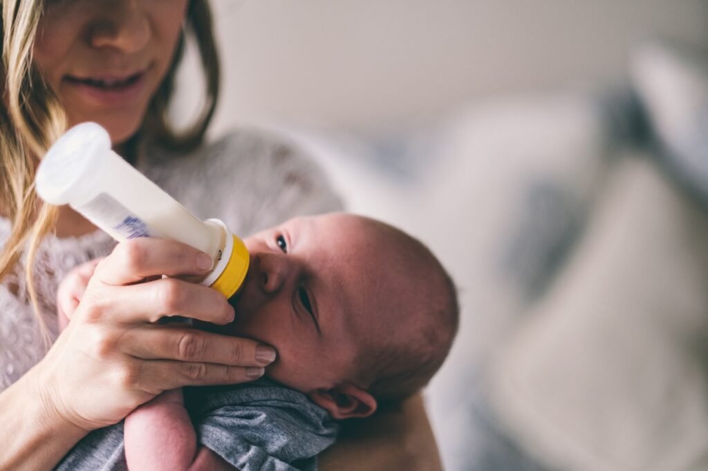 baby drinking from a bottle