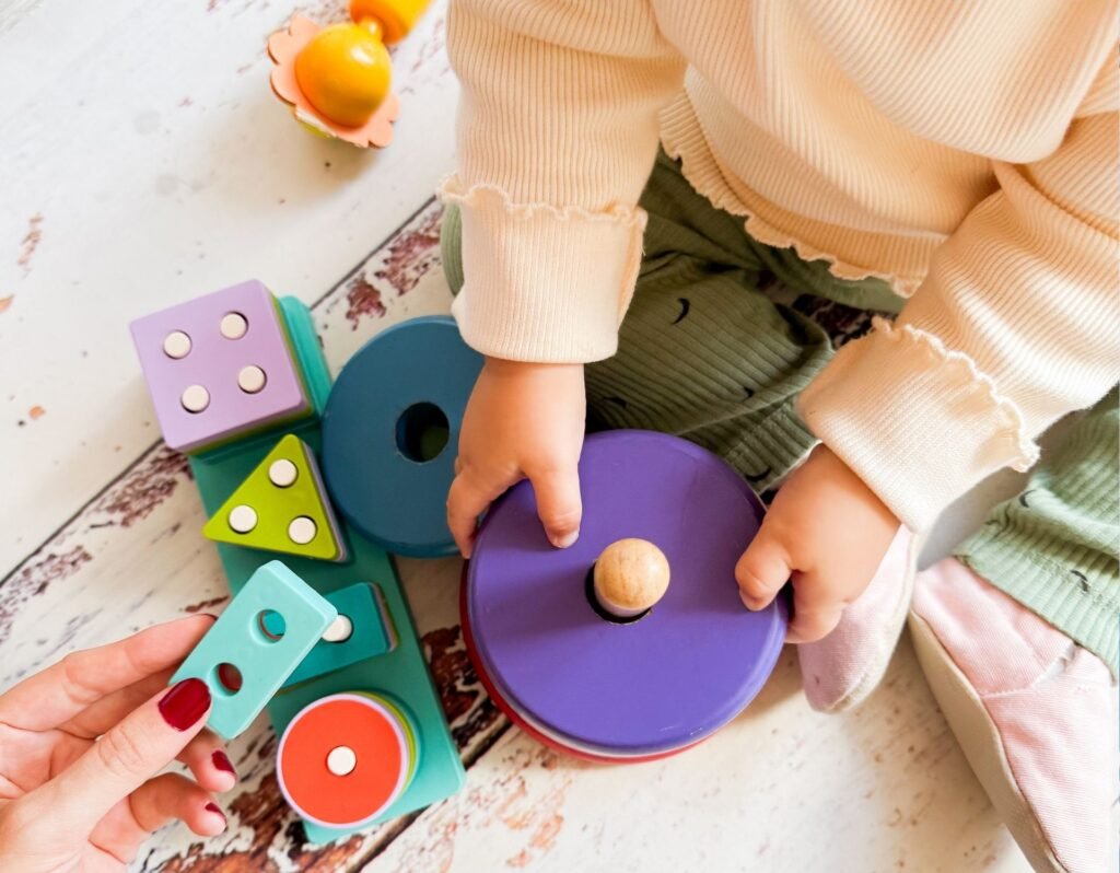 toddler activity playing with stacking ring toy