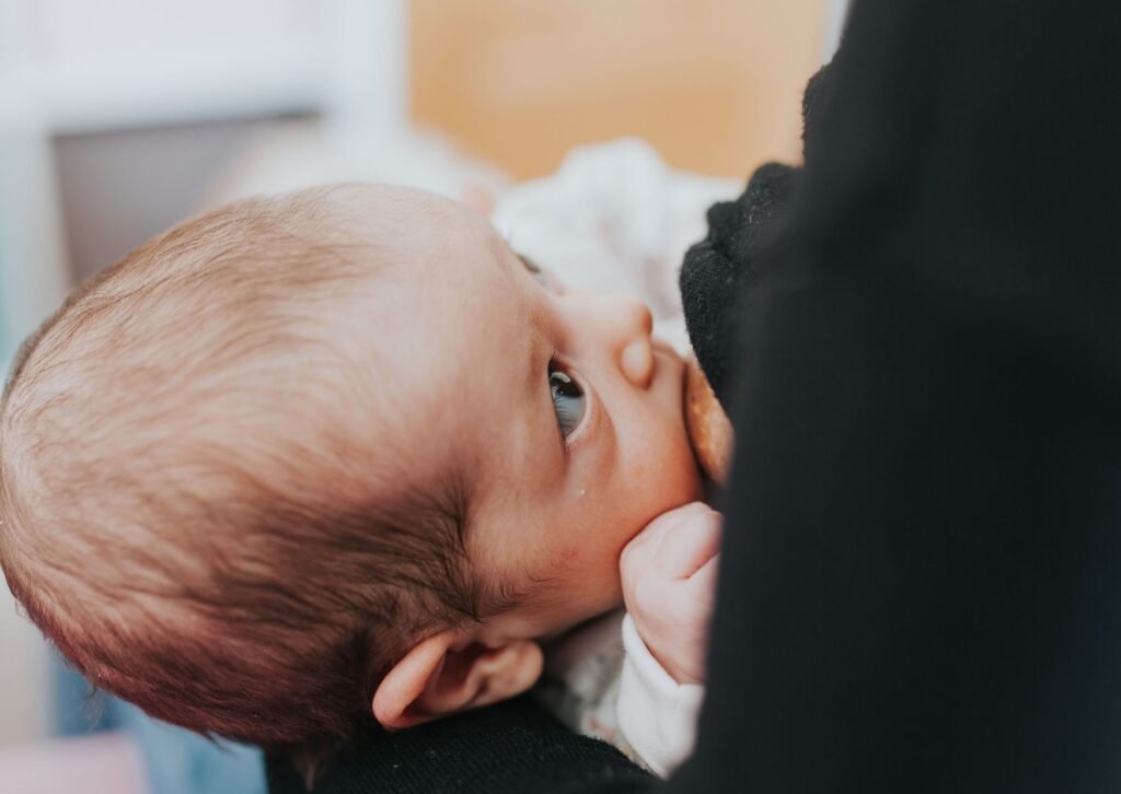 improper breastfeeding latch, babys lips are curled in and should be flanged out. 